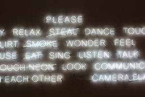 White neon words on a wall
