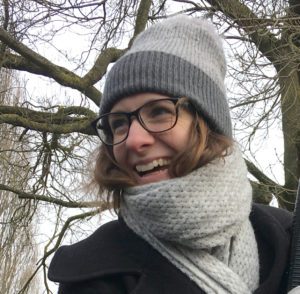 Portrait of Laura Glover, Copywriter wearing a coat, scarf and woolly hat