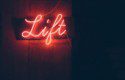 Red neon sign that says 'lift'.